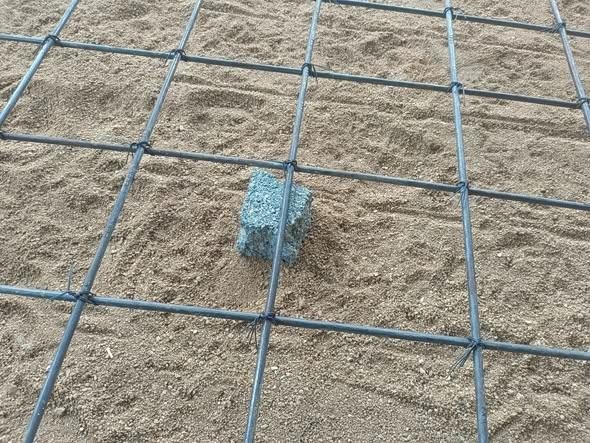 the steel Rebar Grid installed over compacted gravel before the concrete is poured 1